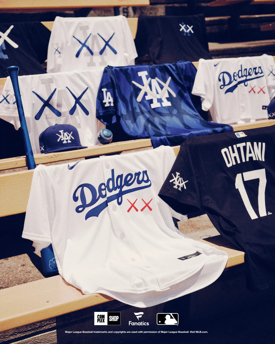 Dodgers pieces from the KAWS × MLB collection on a dugout bench.